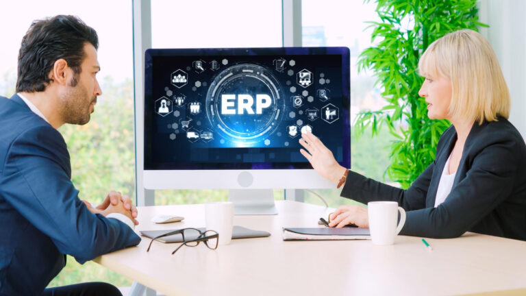 A male and female business team collaborating on an ERP application, focusing on work efficiency and productivity, highlighting Transform ERP with Cloud Integration.