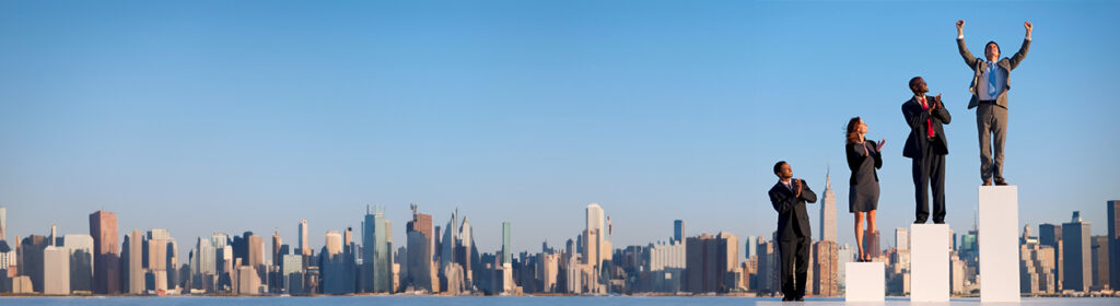 Group of business people standing on ladder with city skyline in background